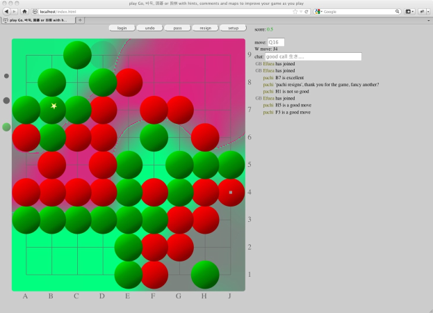 Ein Computermonitor zeigt ein Go-Spiel mit einem Gitter aus roten und grünen Kreisen.