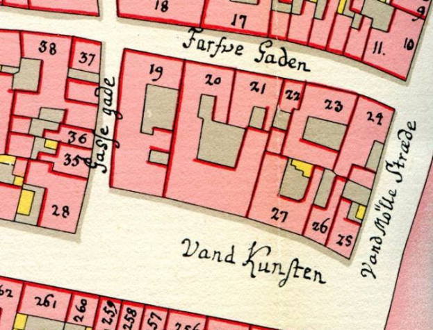 Ein altes Stadtplan von Vand Kunften, Deutschland, mit einem roten und pinken Farbschema, das Straßen, Gebäude und Sehenswürdigkeiten zeigt, zusammen mit Text, der Straßen- und Gebäudenamen angibt.