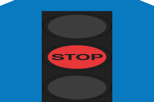 Eine Ampel mit rotem Stoppsignal auf blauem Hintergrund.